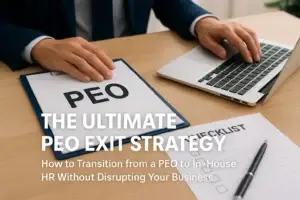 A business professional sits at a desk reviewing a PEO exit strategy document, with a laptop and checklist beside them, representing the transition from a PEO to in-house HR.